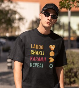 Colourful ladoo, chakli, karenji, repeat text printed diwali themed unisex round neck blended black t-shirt specially for diwali festival