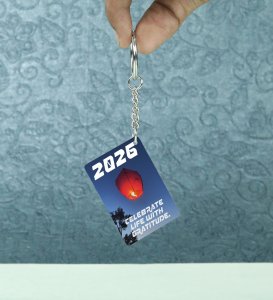 Glowing Red Sky Lantern Floating Above Trees Encouraging Celebration and Gratitude in 2026 Printed Keychain Pack of 2.